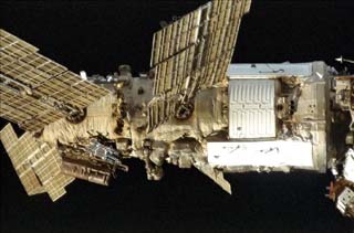 Mir space station taken by the crew of the STS-86 orbiter Atlantis including Damaged Spektr module.